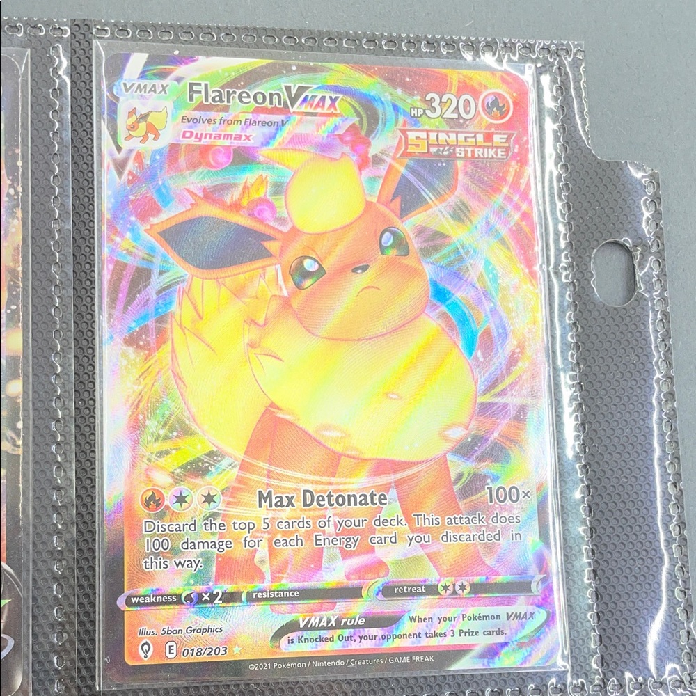 Pokemon Flareon VMAX Card with Vibrant Yellow and Red